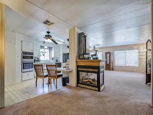 a view of a livingroom with furniture and closet