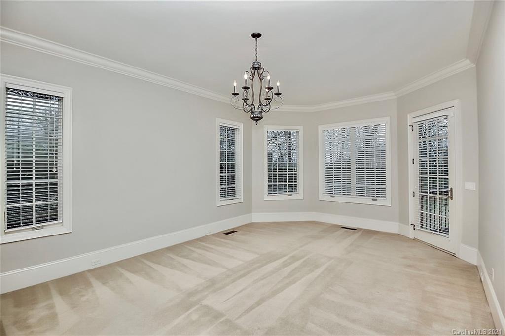 6701 Sharon Road Charlotte, NC 28210 - Photo 11 of 47 a view of an empty room with a window