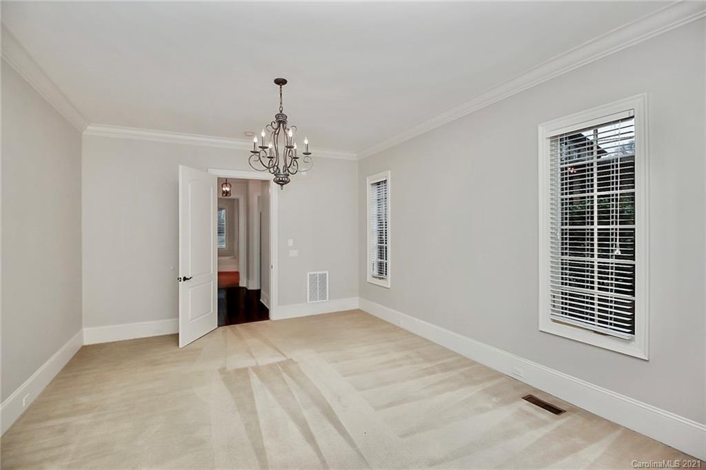 6701 Sharon Road Charlotte, NC 28210 - Photo 12 of 47 a view of a livingroom with a chandelier