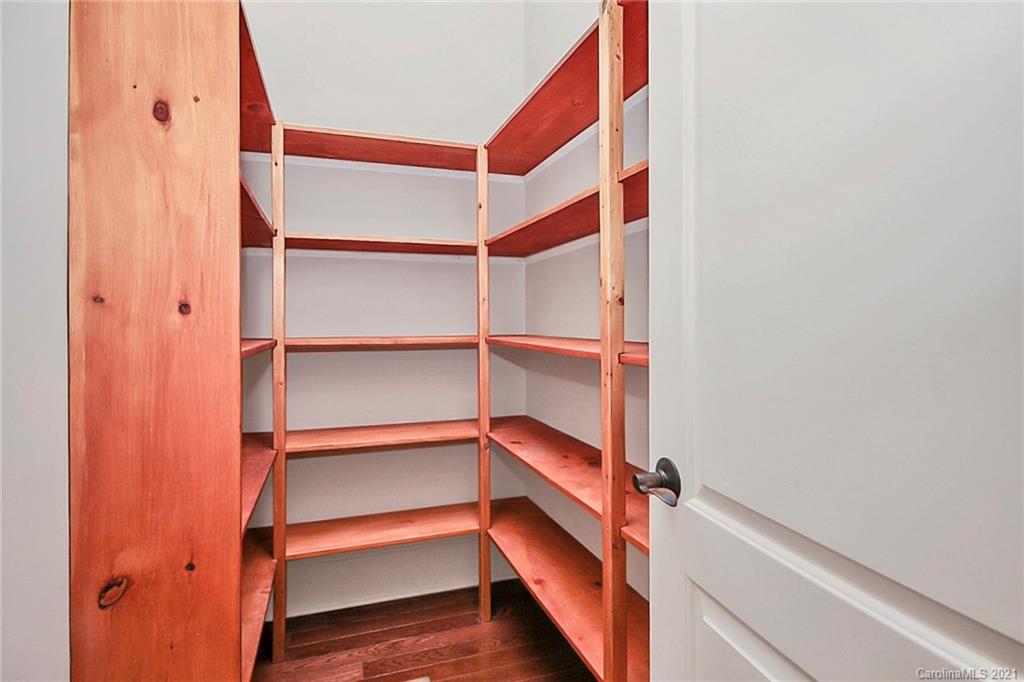6701 Sharon Road Charlotte, NC 28210 - Photo 25 of 47 a view of walk in closet with empty racks