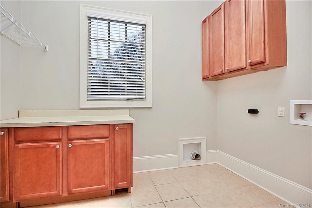 6701 Sharon Road Charlotte, NC 28210 - Photo 26 of 47 a bathroom with a window and a shower