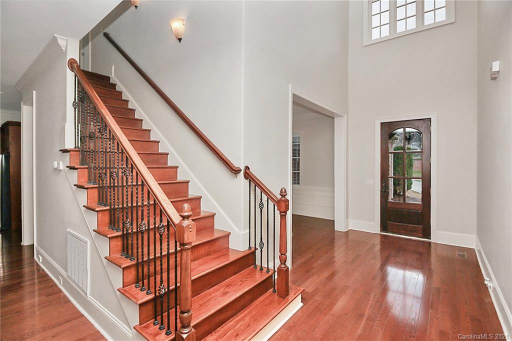 6701 Sharon Road Charlotte, NC 28210 - Photo 28 of 47 a view of entryway and hall with wooden floor