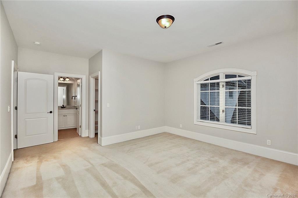 6701 Sharon Road Charlotte, NC 28210 - Photo 30 of 47 an empty room with windows and entrance