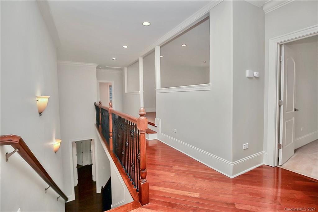 6701 Sharon Road Charlotte, NC 28210 - Photo 36 of 47 a view of a hallway with wooden floor
