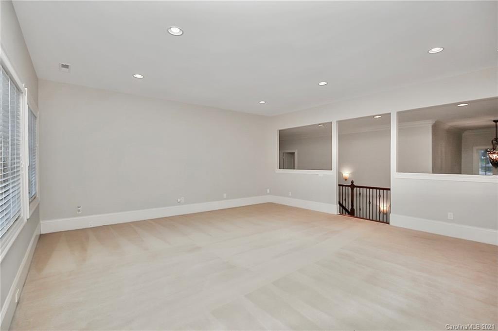 6701 Sharon Road Charlotte, NC 28210 - Photo 38 of 47 an empty room with closet and windows