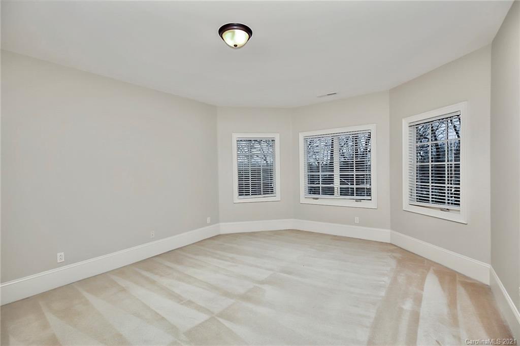 6701 Sharon Road Charlotte, NC 28210 - Photo 39 of 47 a view of an empty room with a window