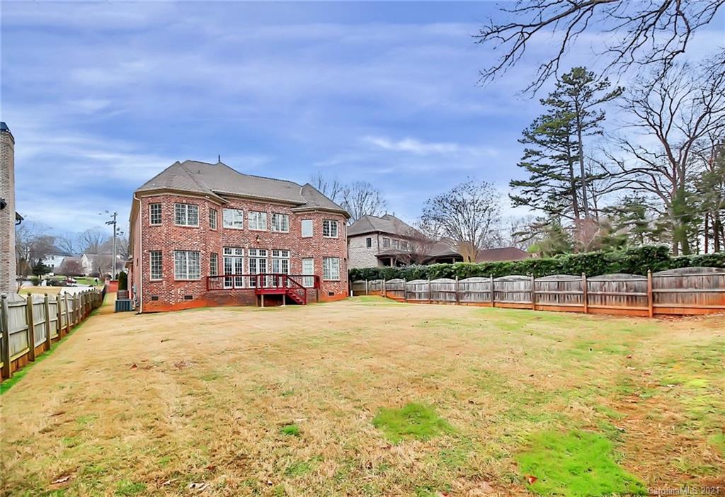 6701 Sharon Road Charlotte, NC 28210 - Photo 42 of 47 a view of a swimming pool with lawn chairs and large trees