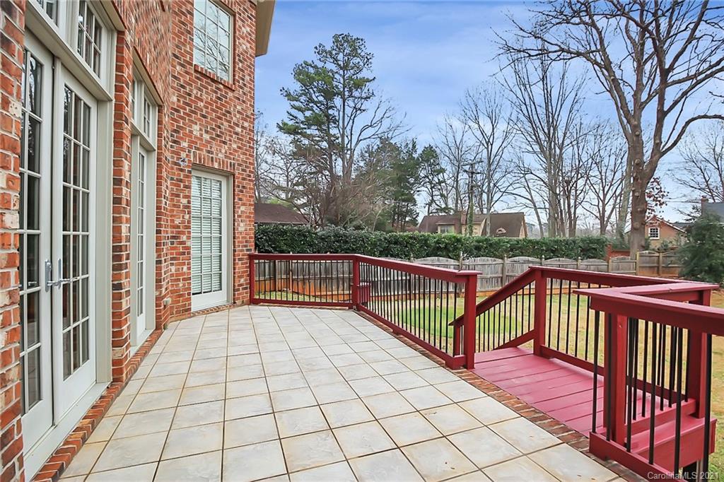 6701 Sharon Road Charlotte, NC 28210 - Photo 45 of 47 a view of a balcony with wooden floor and trees