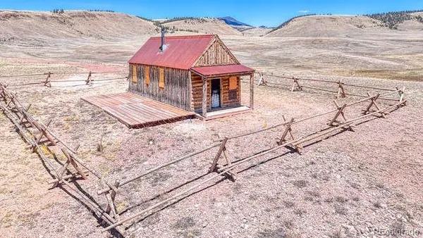 a view of a backyard with wooden fence