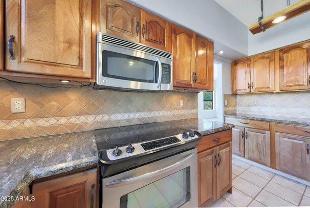 an empty room with wooden floor and sliding door