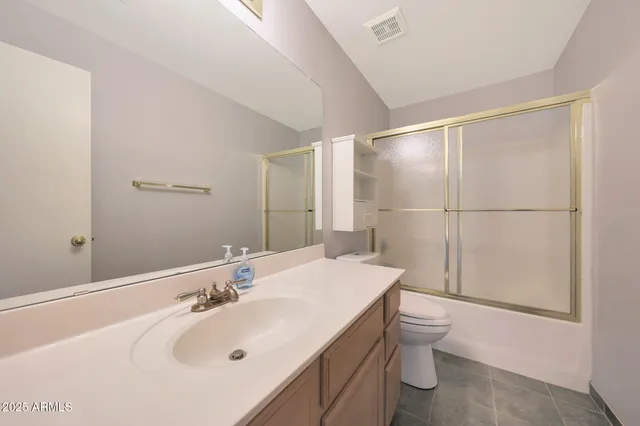 a bathroom with a sink double vanity and a shower