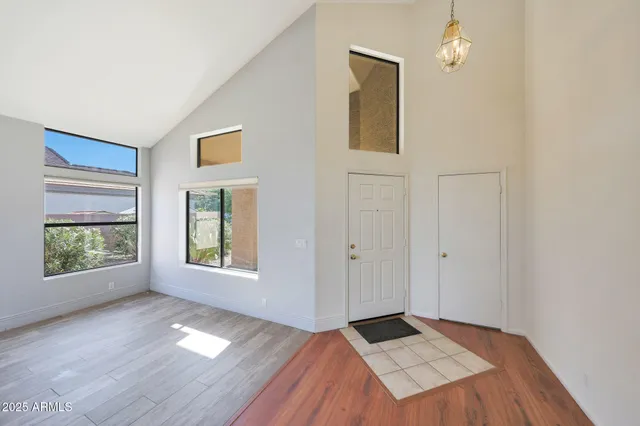 a view of a house with backyard and garden