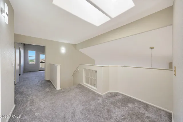 a view of a big room with closet and windows