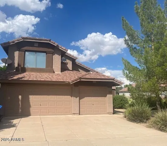a front view of a house with a garage