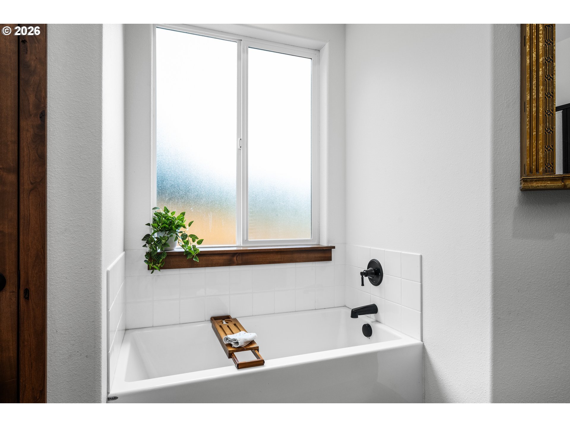 45542 South Gate Creek Road Vida, OR 97488 - Photo 9 of 46 a bath tub sitting in a bathroom next to a window