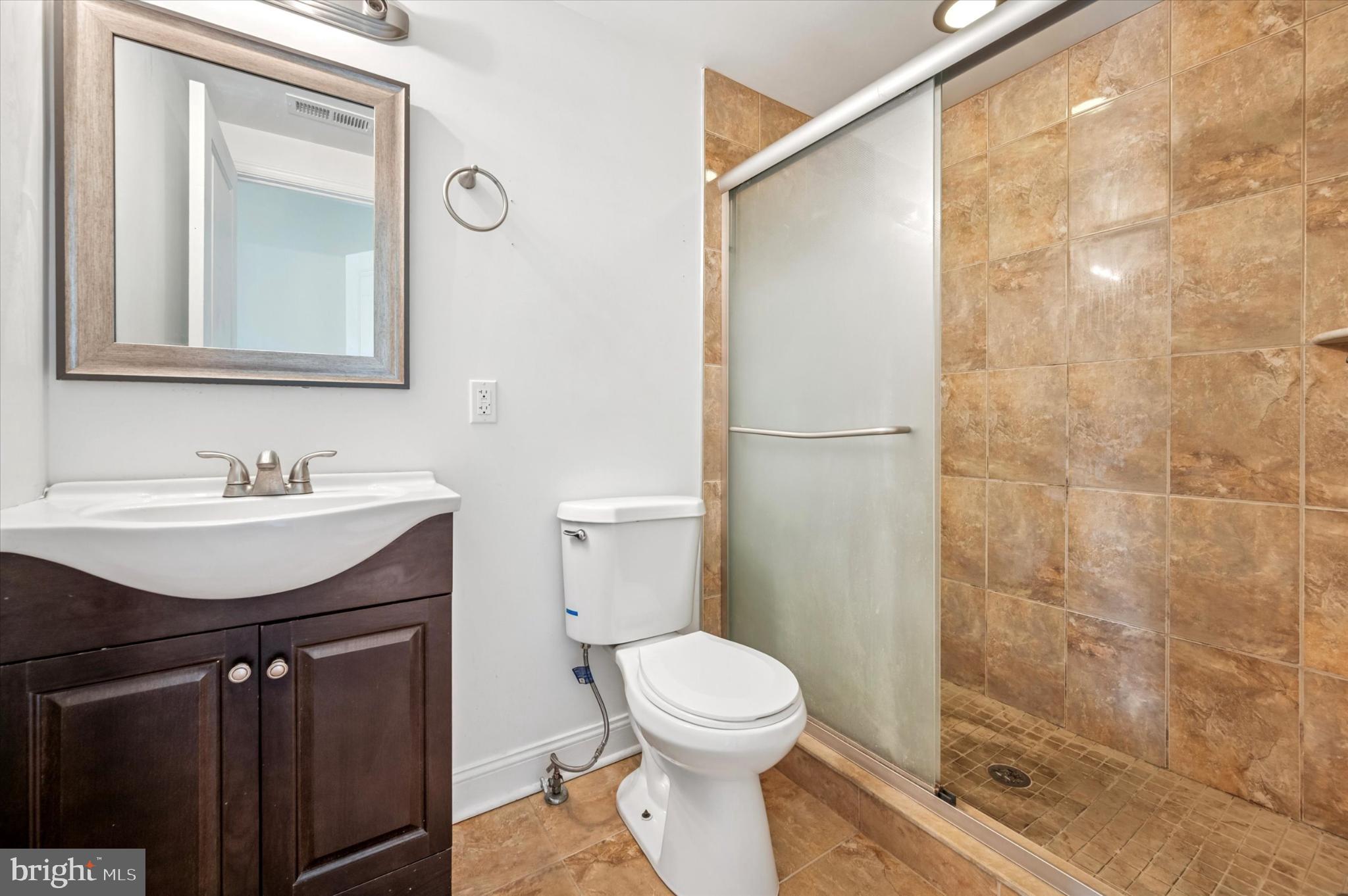 1421 North 18th Street, Unit 3 Philadelphia, PA 19121 - Photo 11 of 16 a bathroom with a sink toilet and shower