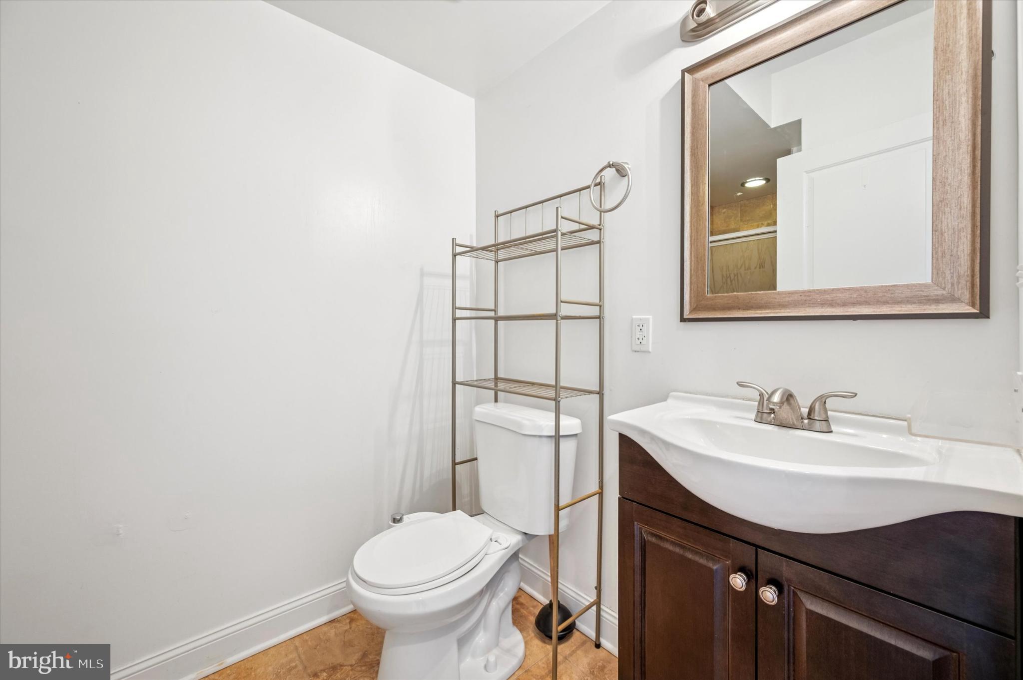 1421 North 18th Street, Unit 3 Philadelphia, PA 19121 - Photo 13 of 16 a bathroom with a sink toilet and mirror