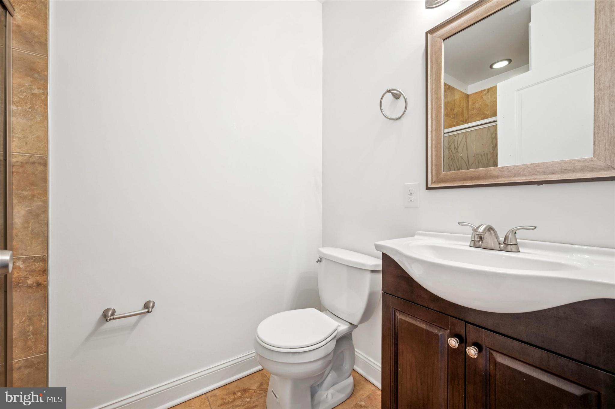 1421 North 18th Street, Unit 3 Philadelphia, PA 19121 - Photo 9 of 16 a bathroom with a sink toilet and mirror