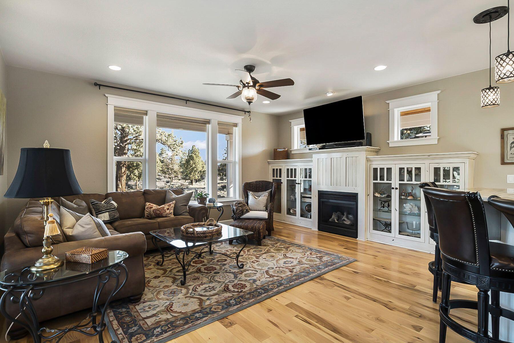 21530 Dale Road Bend, OR 97701 - Photo 13 of 46 a living room with furniture a flat screen tv and a fireplace