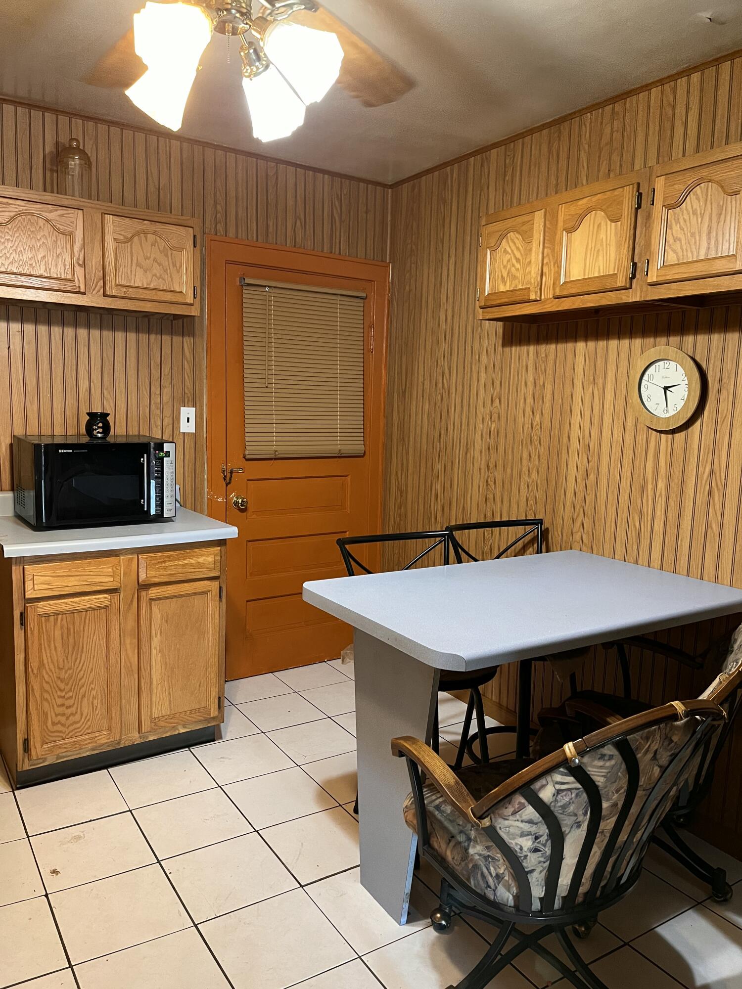 1752 Hayes Street Gary, IN 46404 - Photo 11 of 26 a kitchen with stainless steel appliances a stove a sink cabinets and a dining table