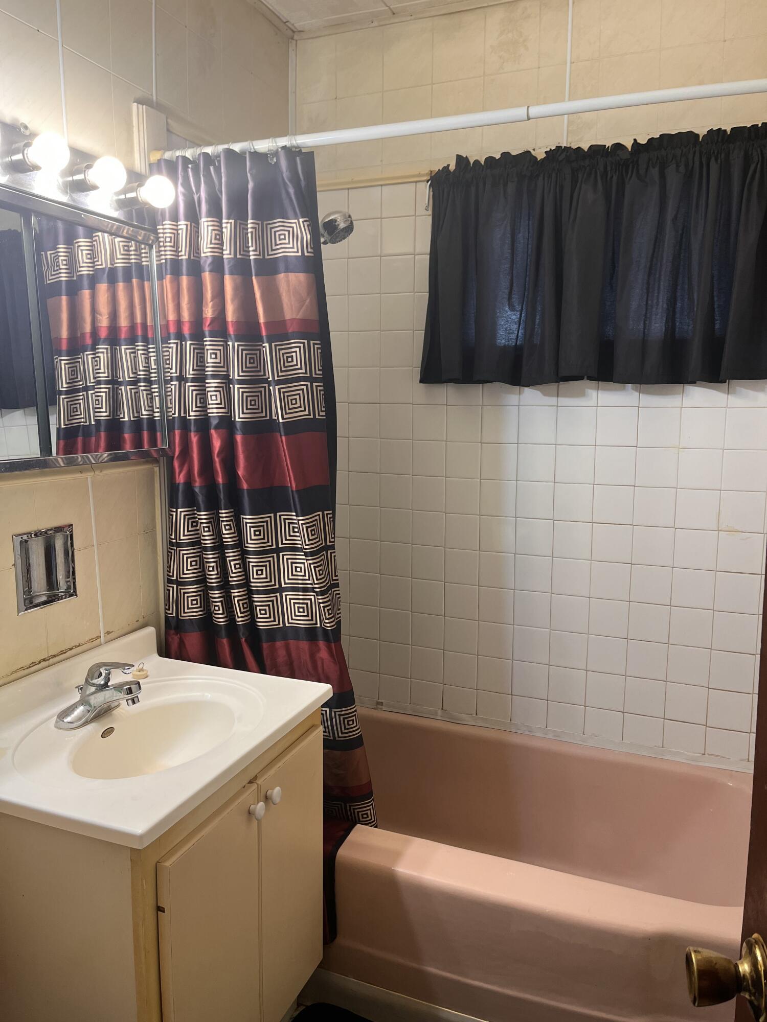 1752 Hayes Street Gary, IN 46404 - Photo 19 of 26 a bathroom with a sink and a bathtub