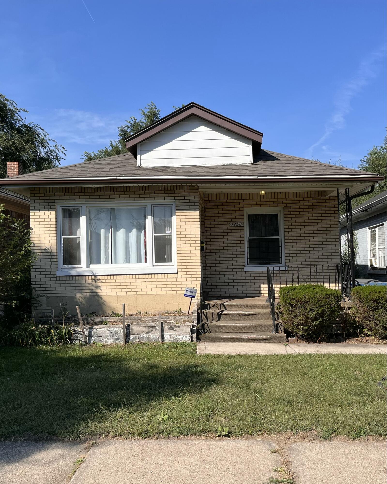 1752 Hayes Street Gary, IN 46404 - Photo 2 of 26 a front view of a house with a yard