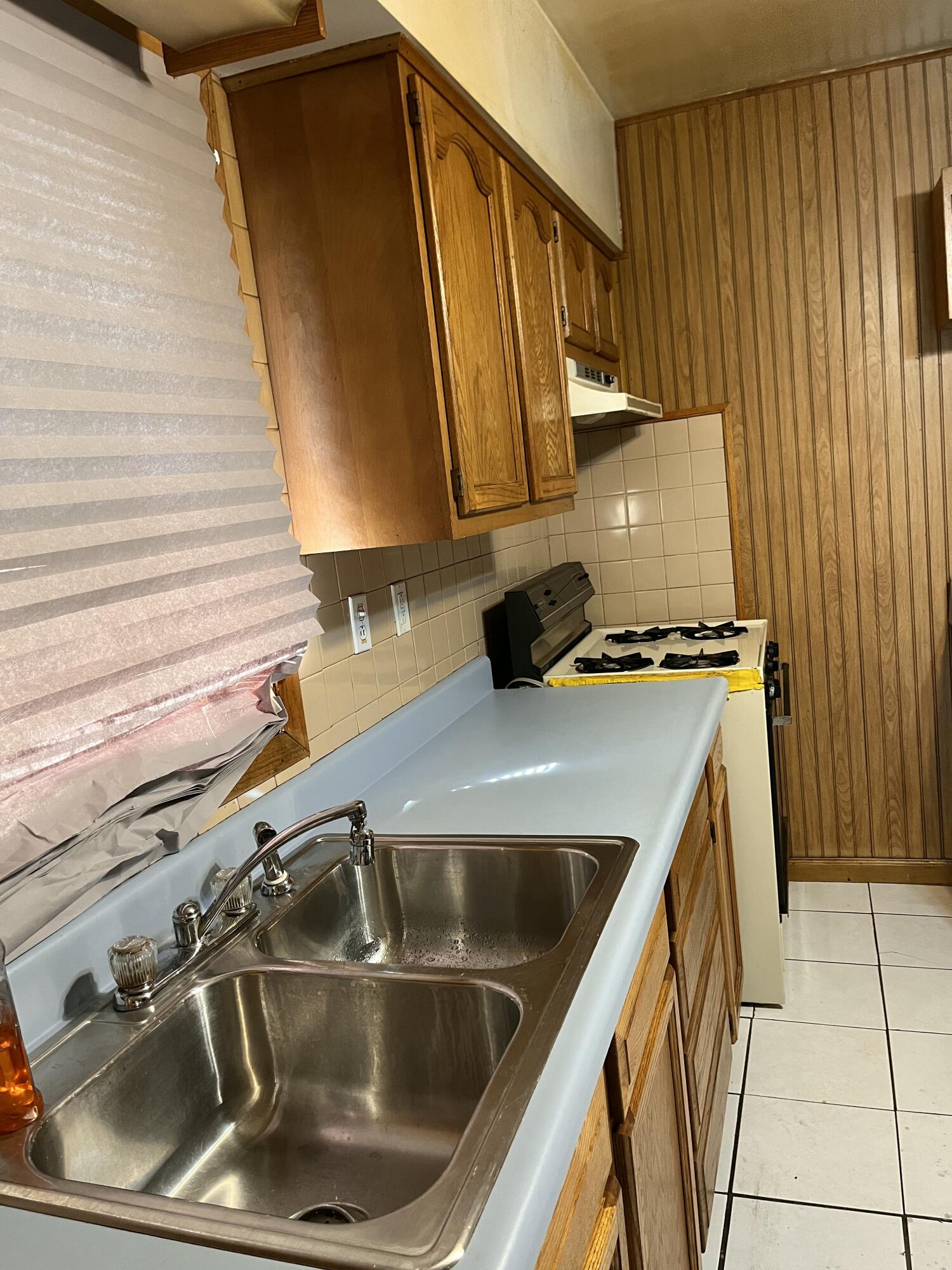 1752 Hayes Street Gary, IN 46404 - Photo 8 of 26 a kitchen with a sink and a stove top oven