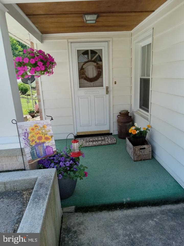 24265 Path Valley Road Concord, PA 17217 - Photo 34 of 36 Front porch summer view