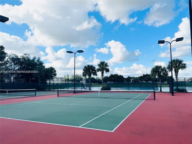 a view of swimming pool with outdoor seating and lake