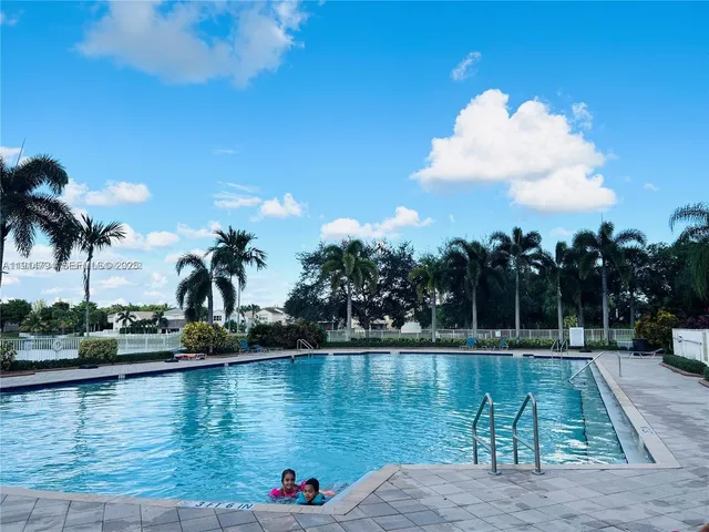 a view of a swimming pool with a chair