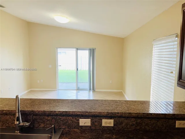 a view of a bathroom with sink and window