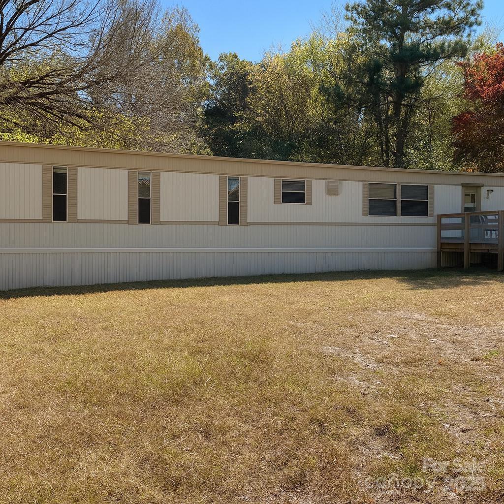 5909 Crawford Road Gastonia, NC 28052 - Photo 3 of 8 a house view with a backyard space