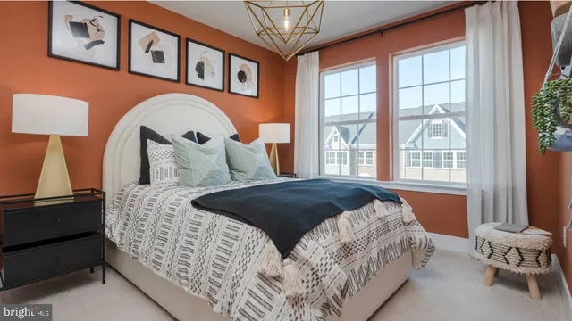 a bedroom with a large bed and a window with the outer view