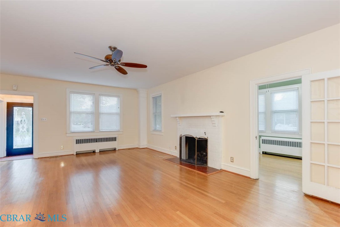 144 Meredith Street Hampton, VA 23669 - Photo 9 of 36 wooden floor in an empty room with a window
