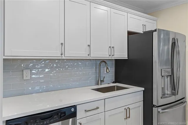 a kitchen with a sink and cabinets
