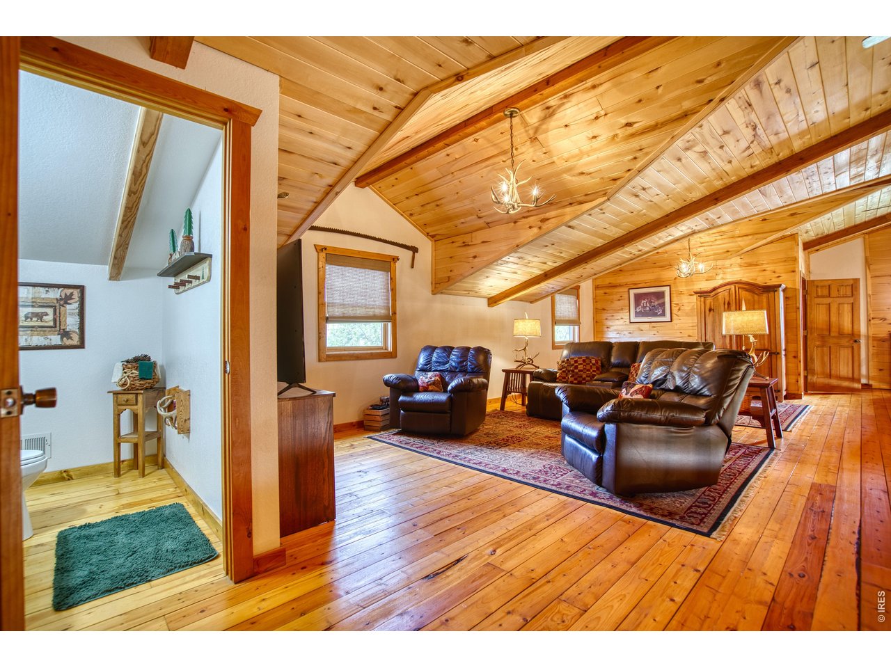 320 Del Monte Road Berthoud, CO 80513 - Photo 16 of 40 a living room with furniture and a wooden floor