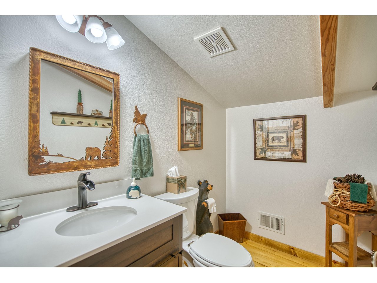 320 Del Monte Road Berthoud, CO 80513 - Photo 18 of 40 a bathroom with a sink and a mirror