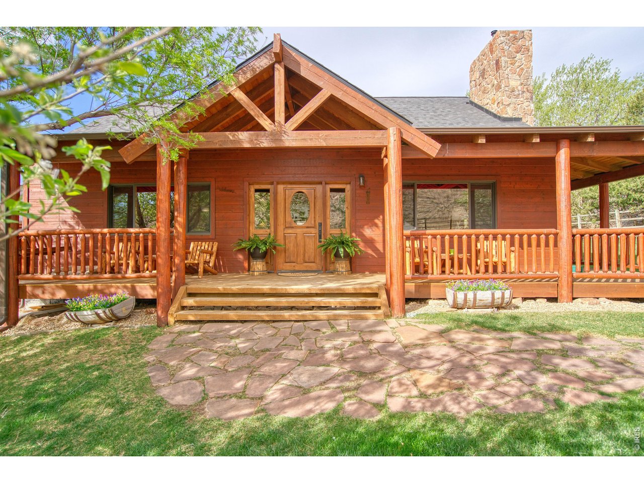 320 Del Monte Road Berthoud, CO 80513 - Photo 2 of 40 a view of a house with wooden floor and a yard