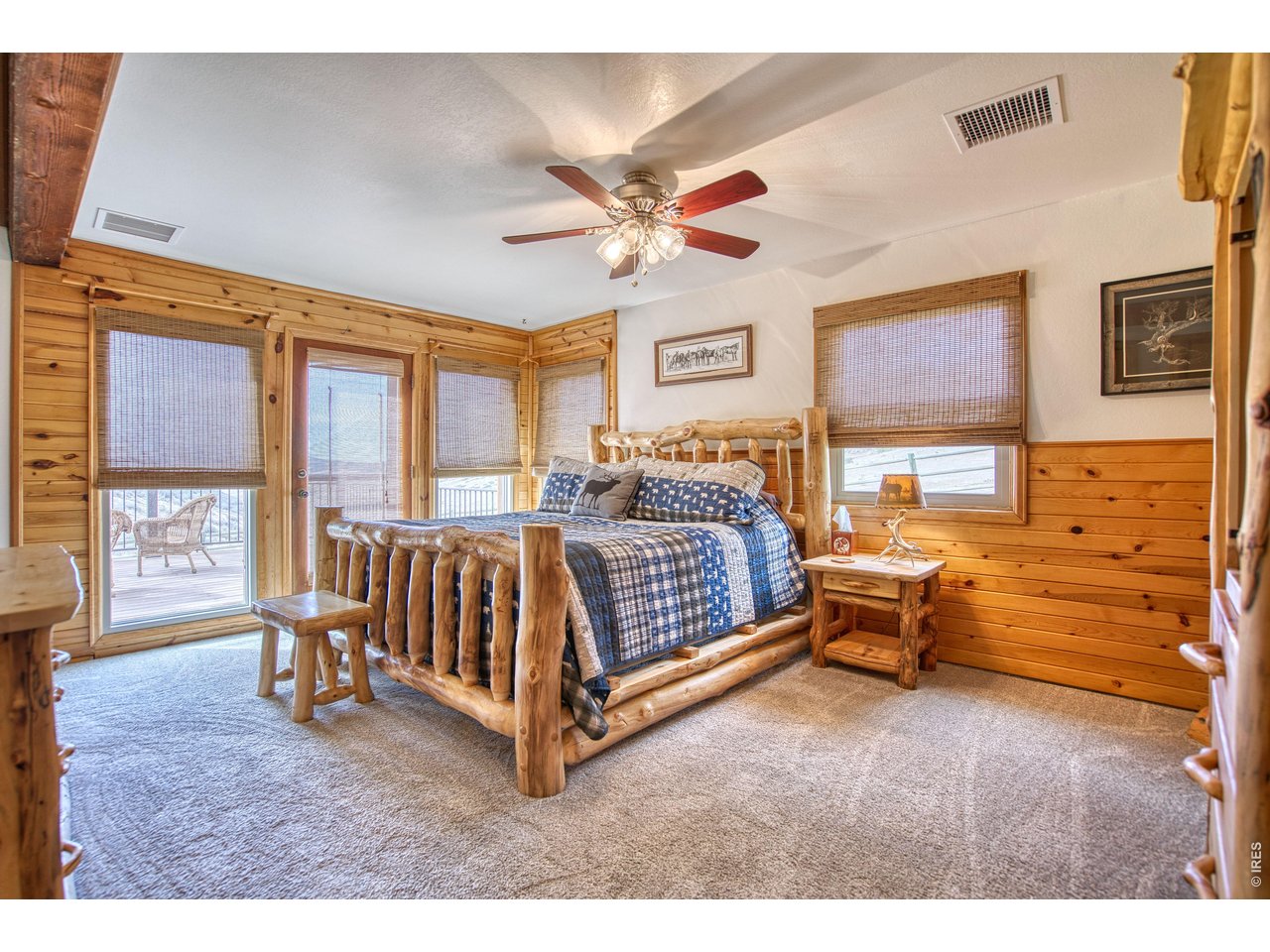 320 Del Monte Road Berthoud, CO 80513 - Photo 21 of 40 a bedroom with a bed and a large window