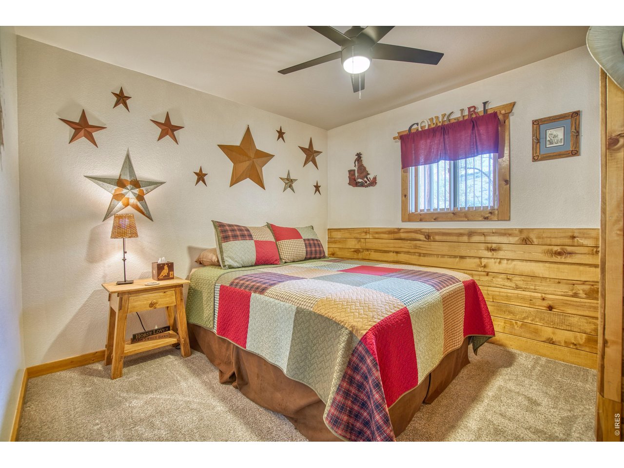 320 Del Monte Road Berthoud, CO 80513 - Photo 26 of 40 a bedroom with a bed and window