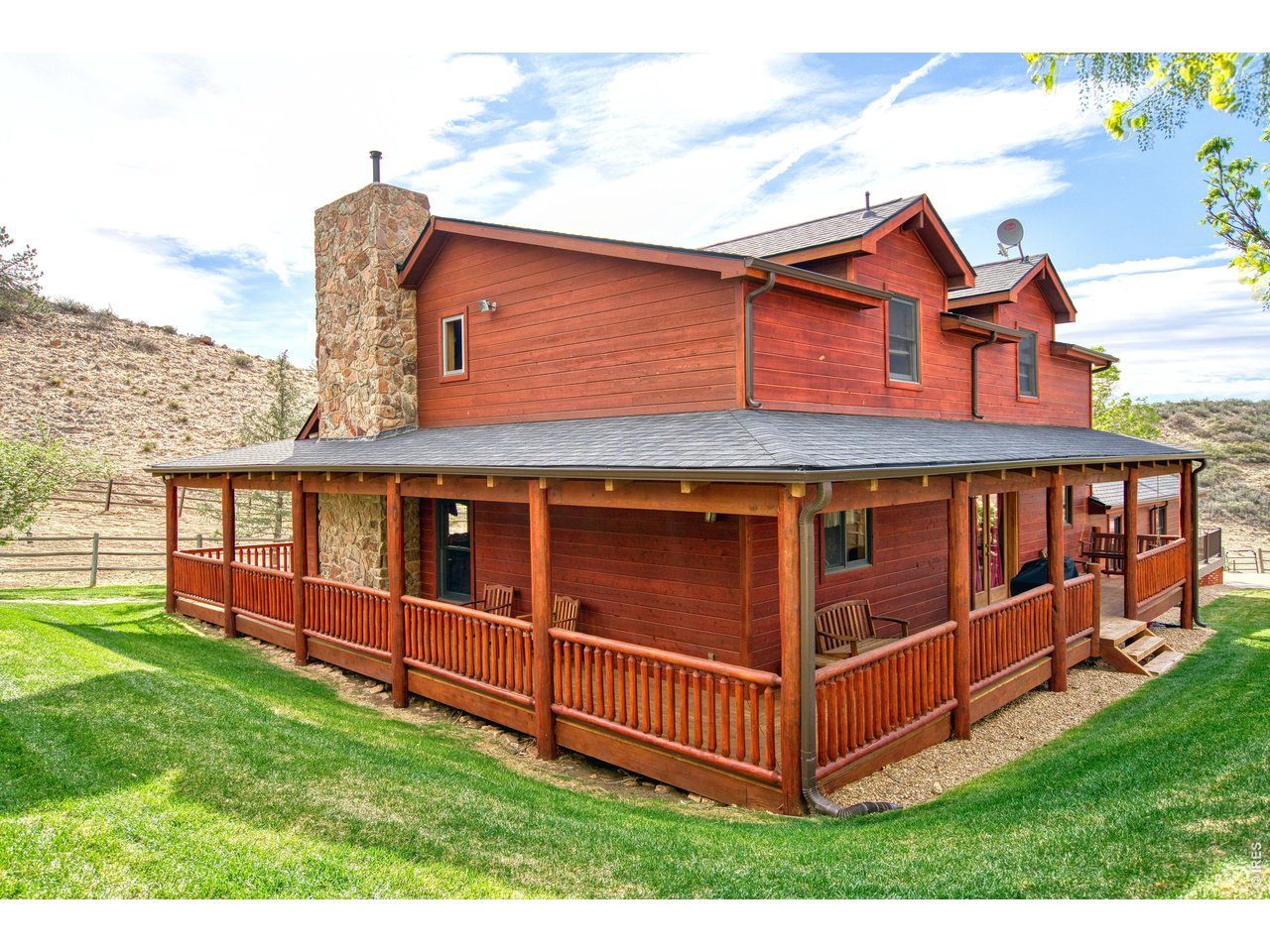 320 Del Monte Road Berthoud, CO 80513 - Photo 3 of 40 a view of a house with a yard and deck
