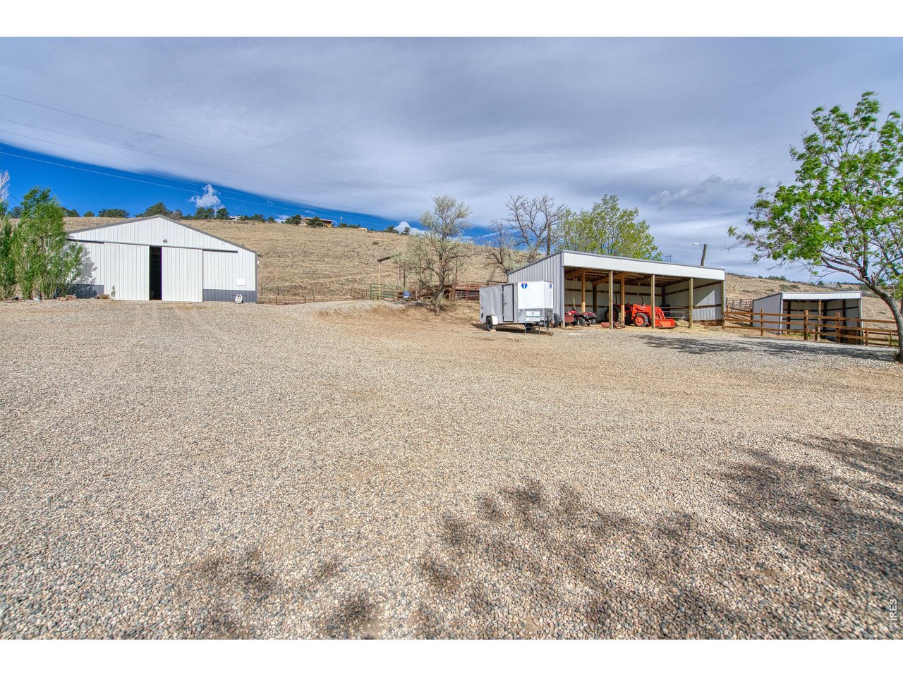 320 Del Monte Road Berthoud, CO 80513 - Photo 35 of 40 a front view of a house with a yard and garage