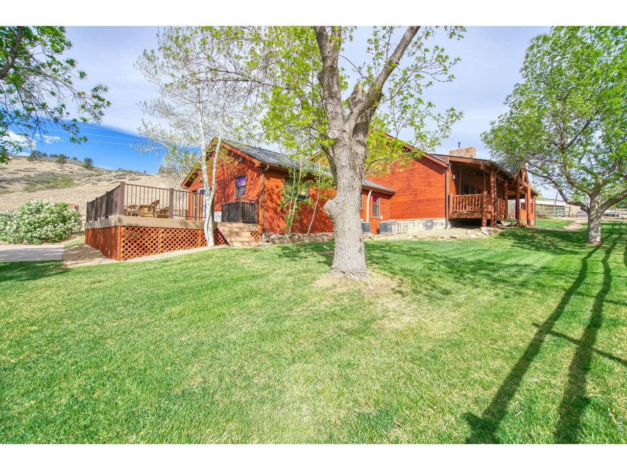 320 Del Monte Road Berthoud, CO 80513 - Photo 5 of 40 a front view of house with yard and trees