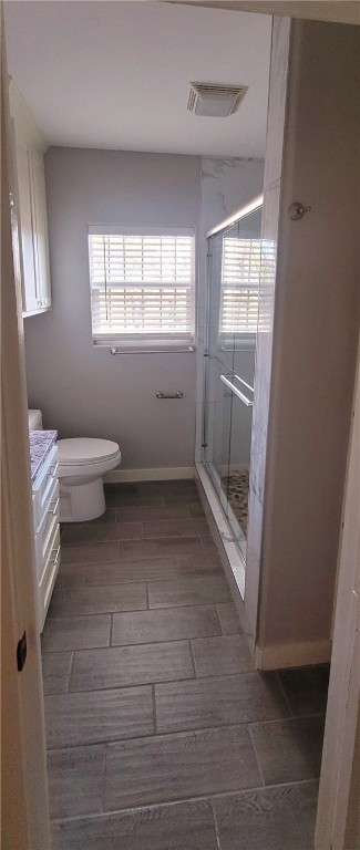 104 Hub Street Alice, TX 78332 - Photo 13 of 15 a bathroom with a toilet sink and a window