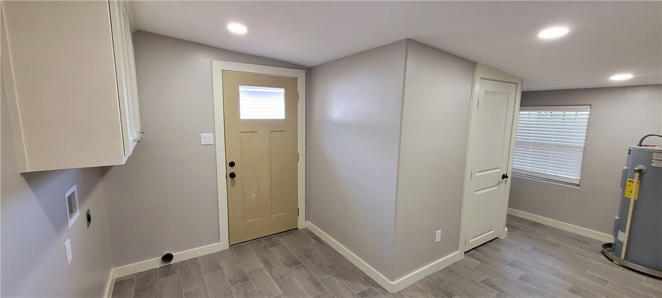 104 Hub Street Alice, TX 78332 - Photo 14 of 15 an empty room with wooden floor and a window