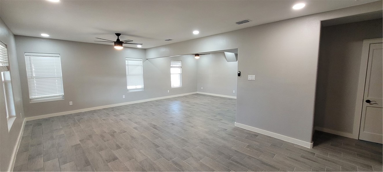 104 Hub Street Alice, TX 78332 - Photo 5 of 15 a view of empty room with wooden floor and fan