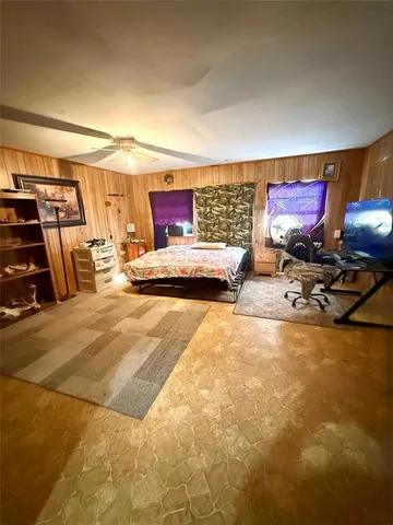 a room with gym equipment and a flat screen tv