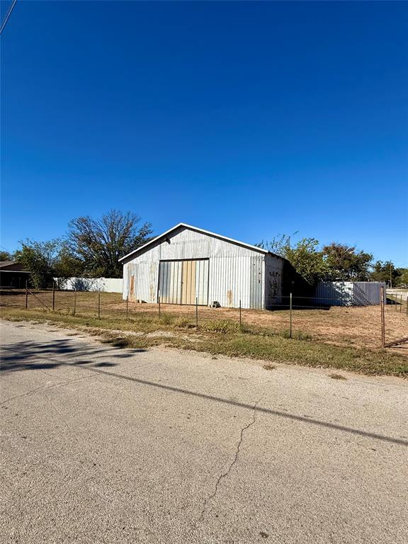 704 Post Street Coleman, TX 76834 - Photo 17 of 40 a view of a house with a yard