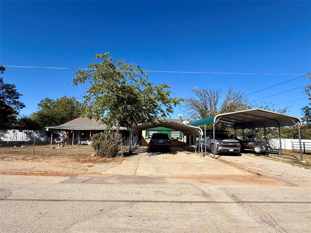 704 Post Street Coleman, TX 76834 - Photo 2 of 40 a view of a outdoor space with trees and umbrellas