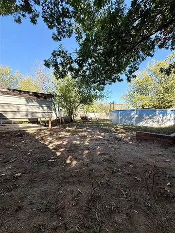 a view of a yard with an outdoor space